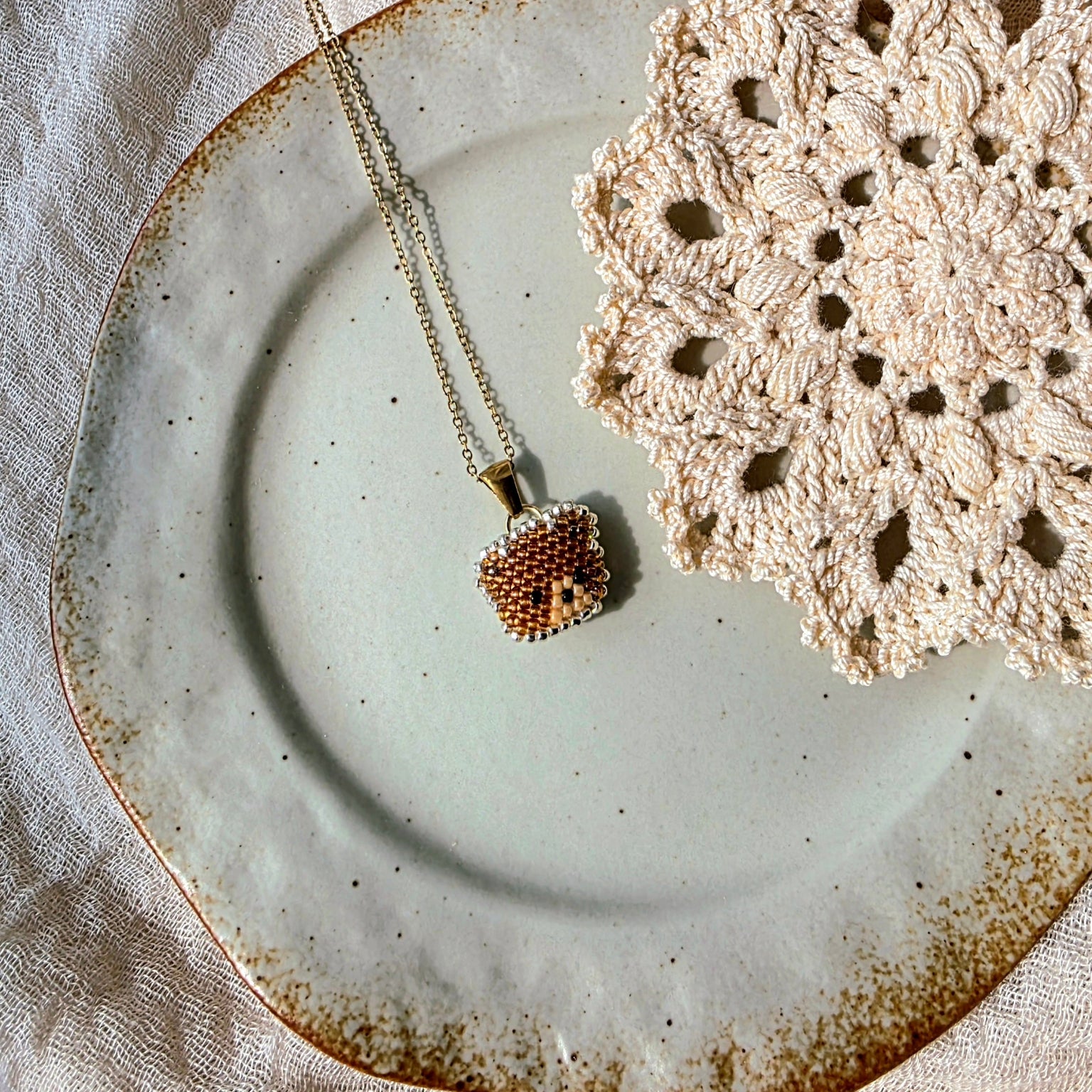 Brown bear necklace left