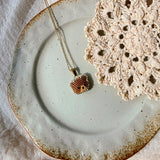 Brown bear necklace left