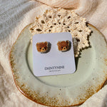 Brown bear stud earrings on card