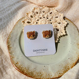 Brown bear stud earrings on card