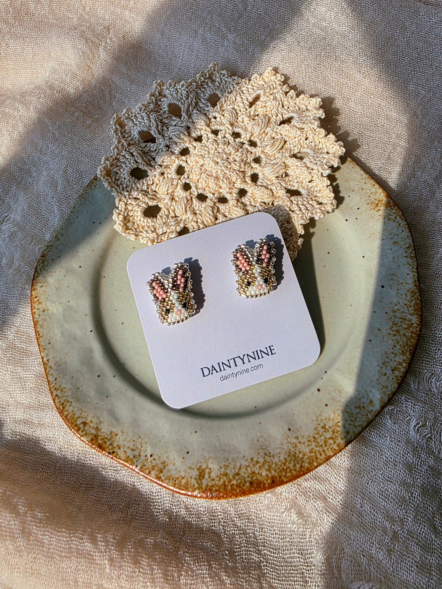 Brown bunny stud earrings on card
