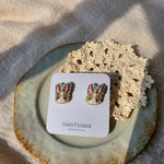 Brown bunny stud earrings on card front