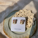 Brown bunny stud earrings on card front