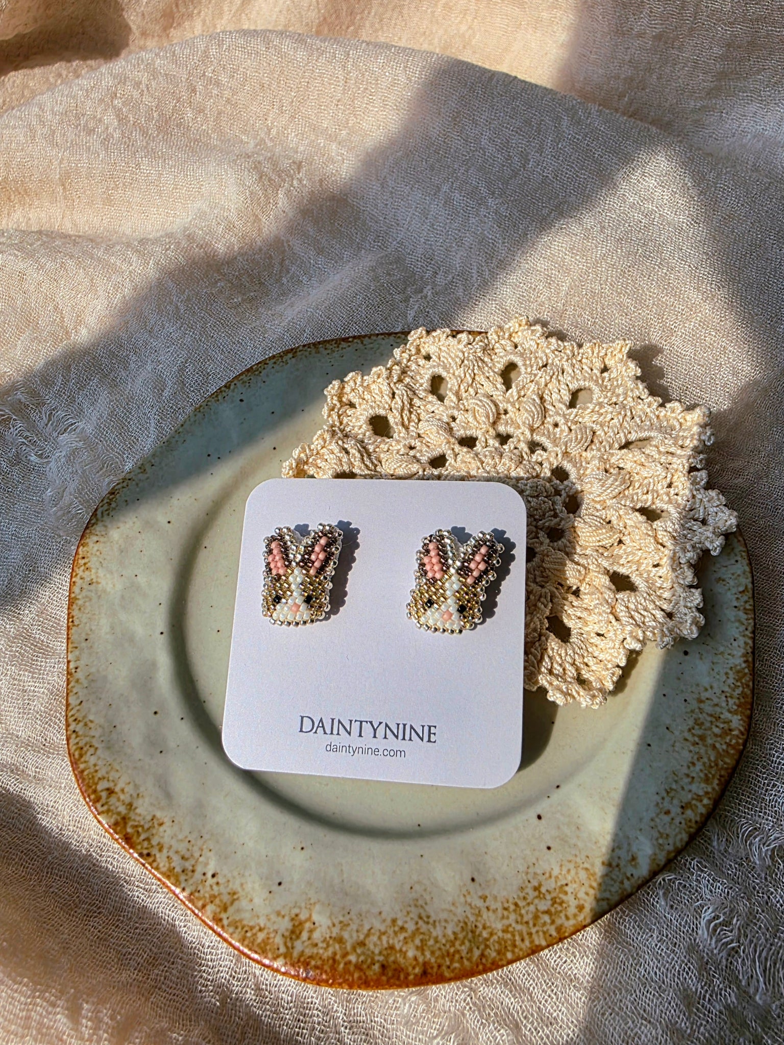 Brown bunny stud earrings on card front