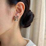 Brown bunny stud earrings on model
