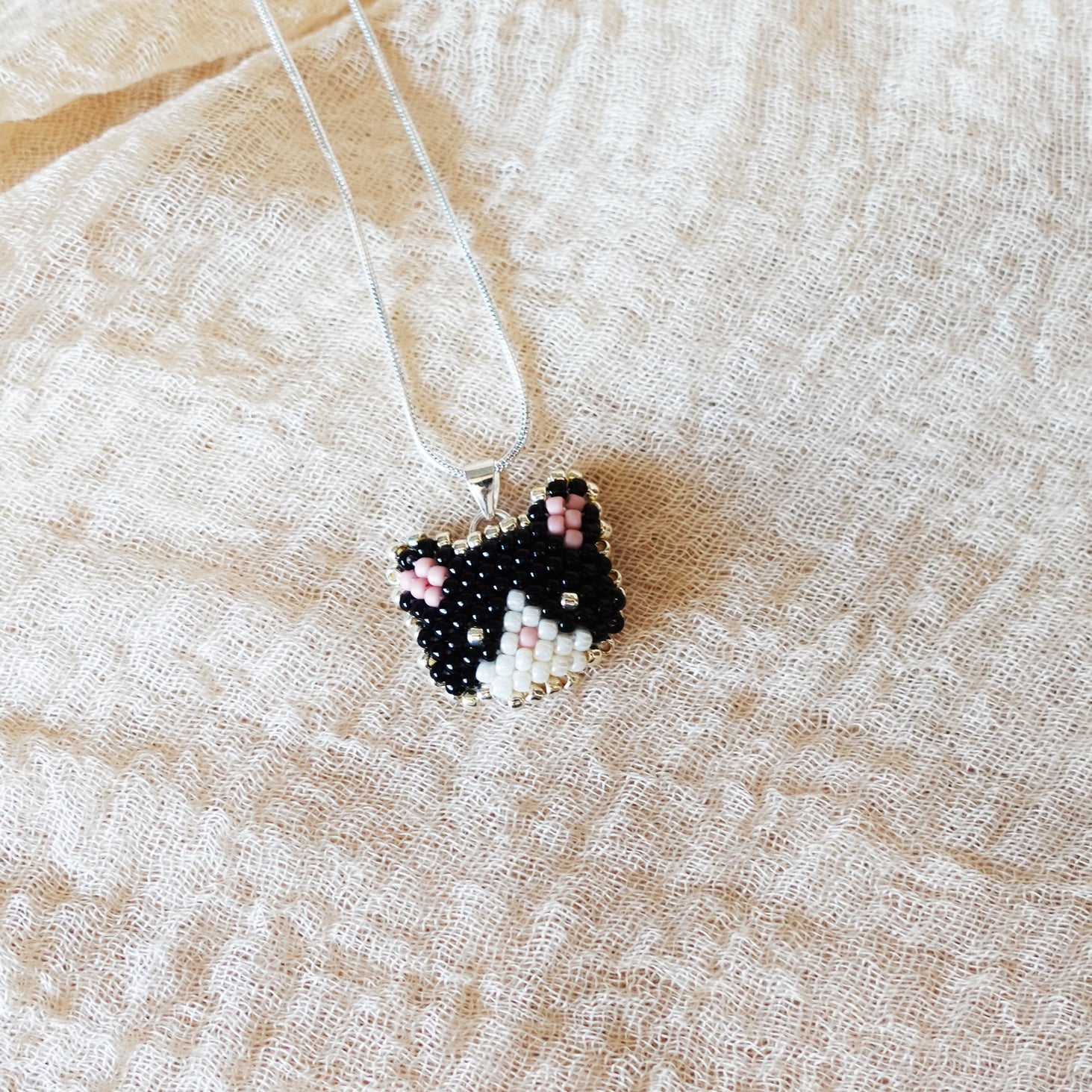 Calico Cat Necklace in Black and White Left
