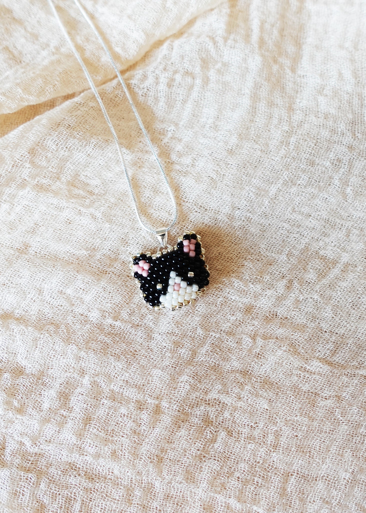 Calico Cat Necklace in Black and White Left