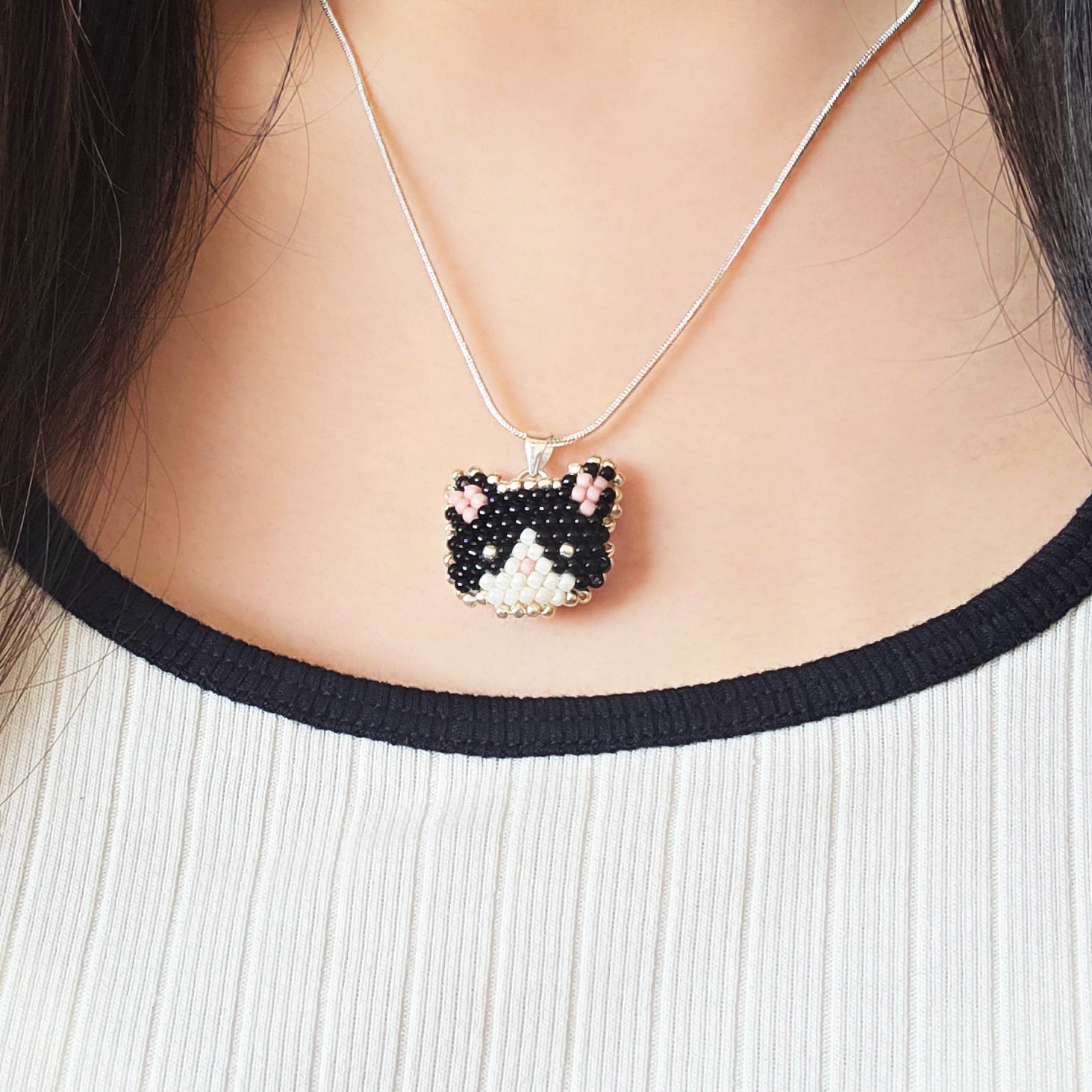 Calico Cat Necklace in Black and White Model Close