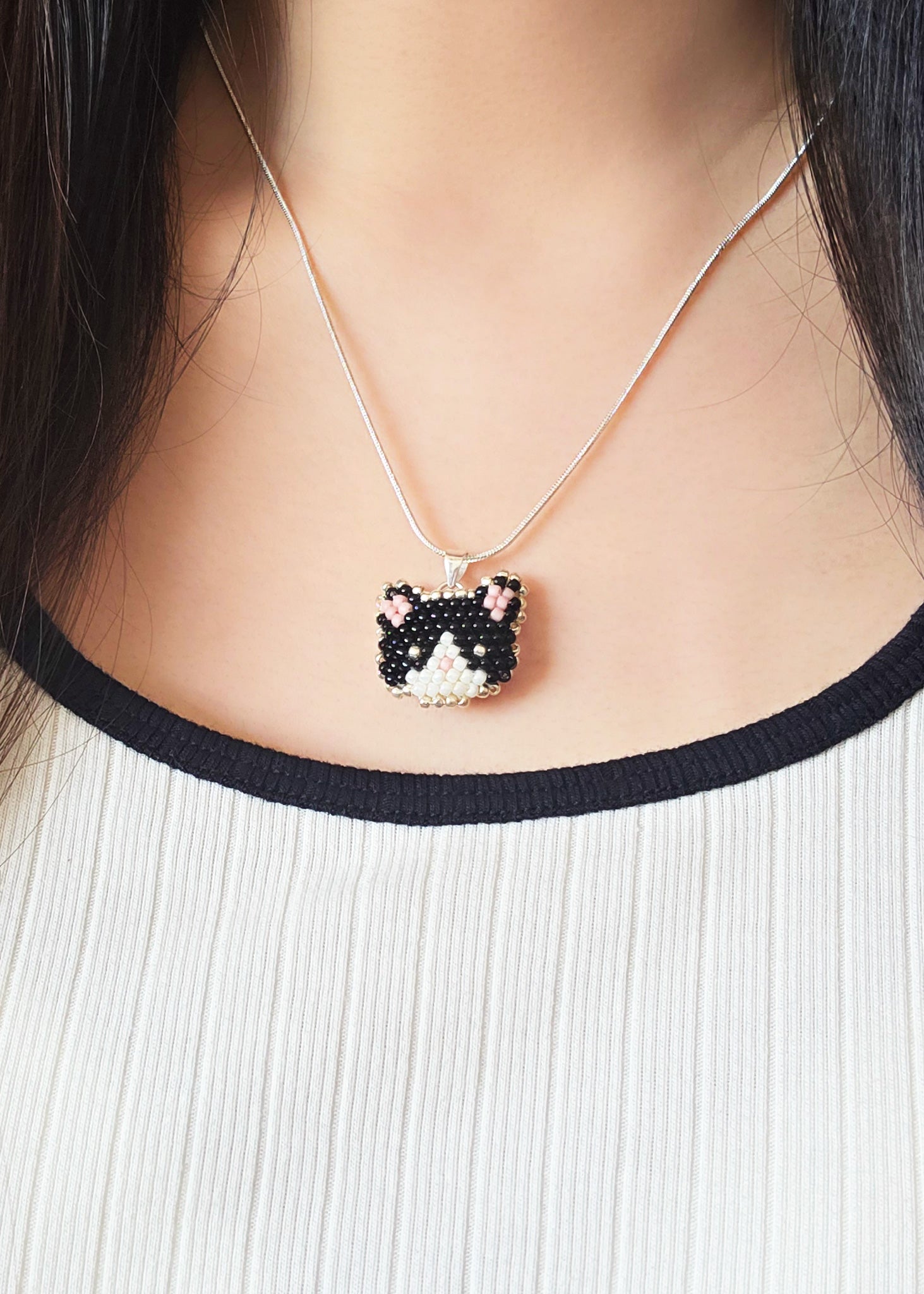 Calico Cat Necklace in Black and White Model Close