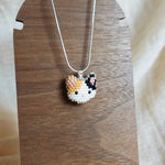 Calico Cat Necklace in Orange and Black Display Left