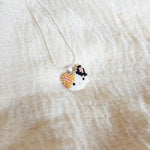 Calico Cat Necklace in Orange and Black Left