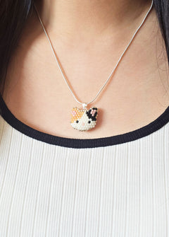 Calico Cat Necklace in Orange and Black Model Close