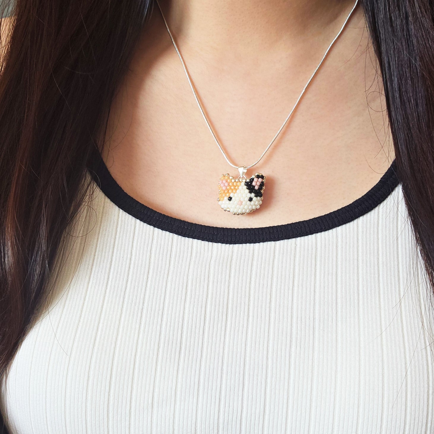Calico Cat Necklace in Orange and Black Model