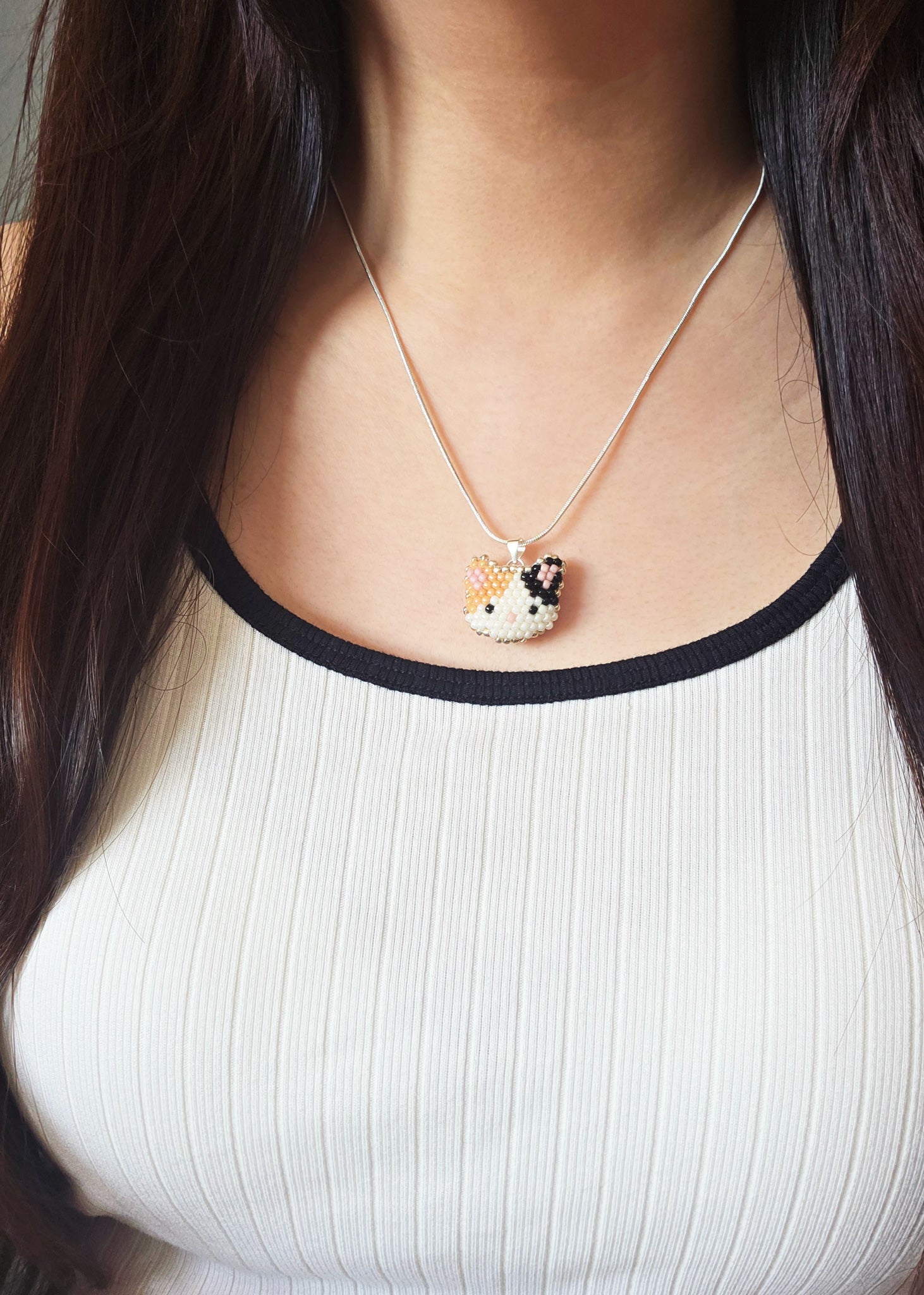 Calico Cat Necklace in Orange and Black Model