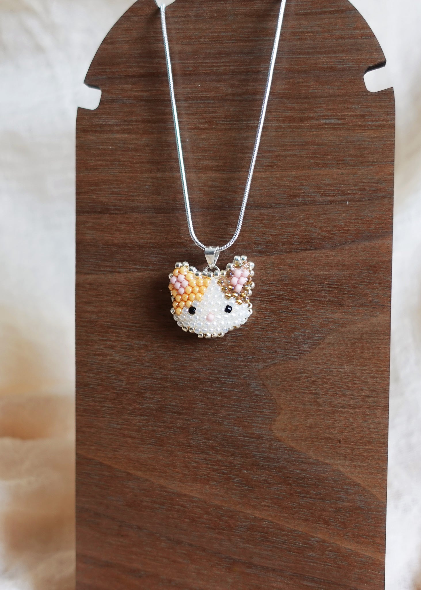Calico Cat Necklace in Orange and Brown Display Front