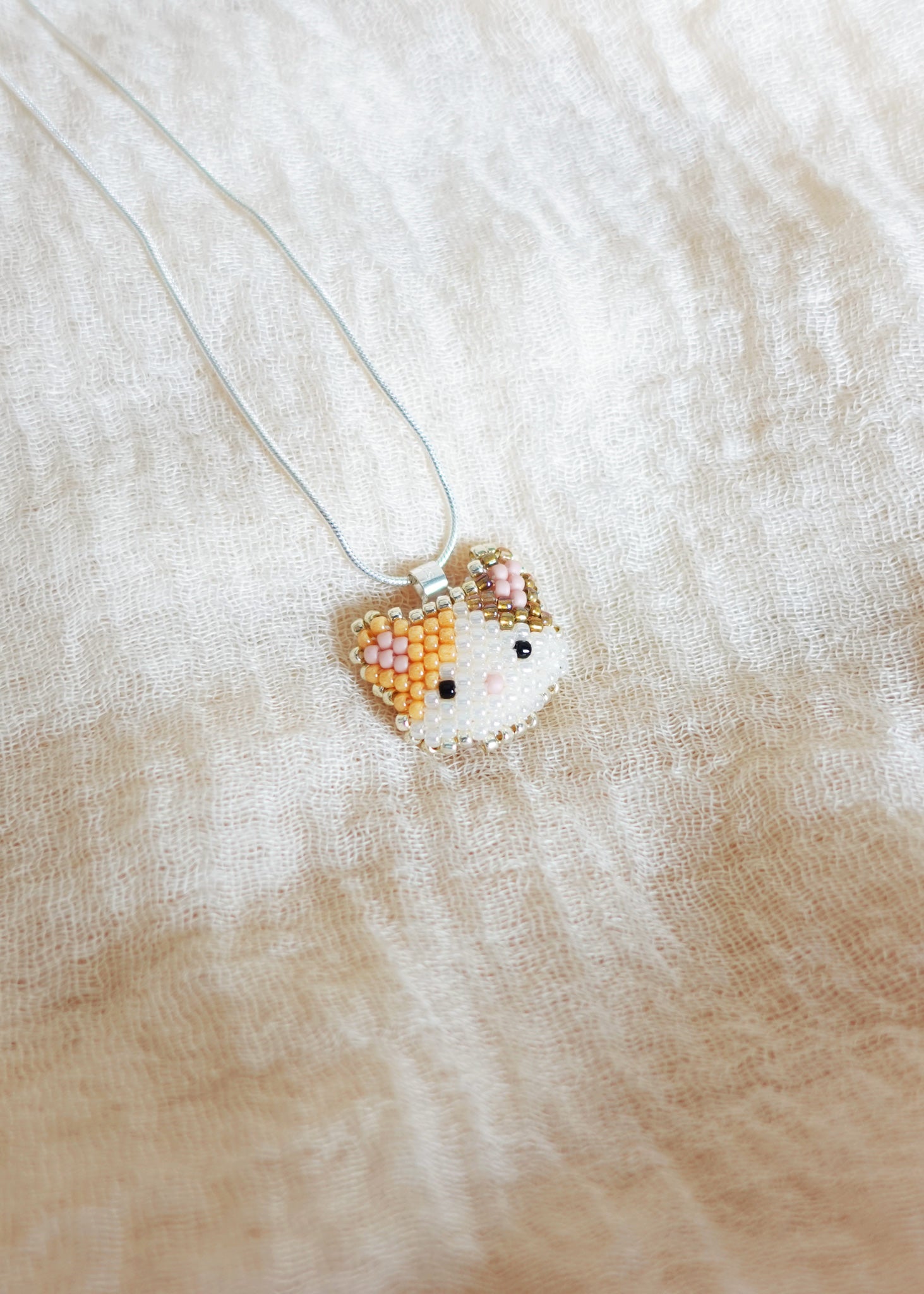 Calico Cat Necklace in Orange and Brown Left