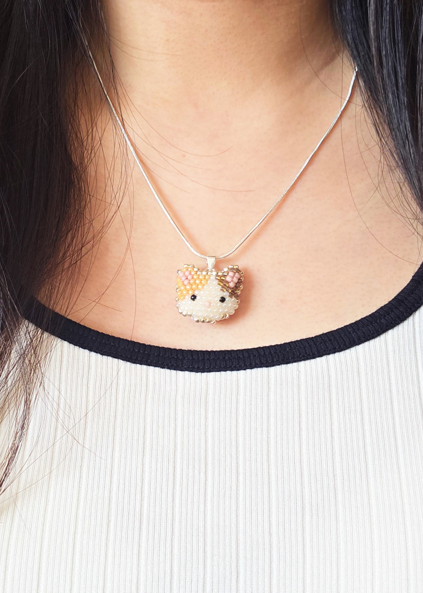 Calico Cat Necklace in Orange and Brown Model Close