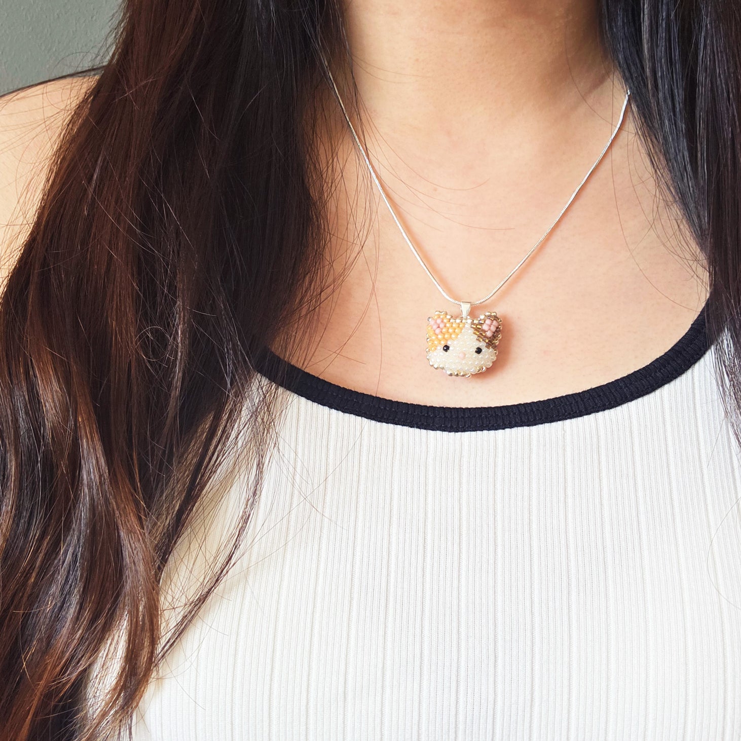 Calico Cat Necklace in Orange and Brown Model