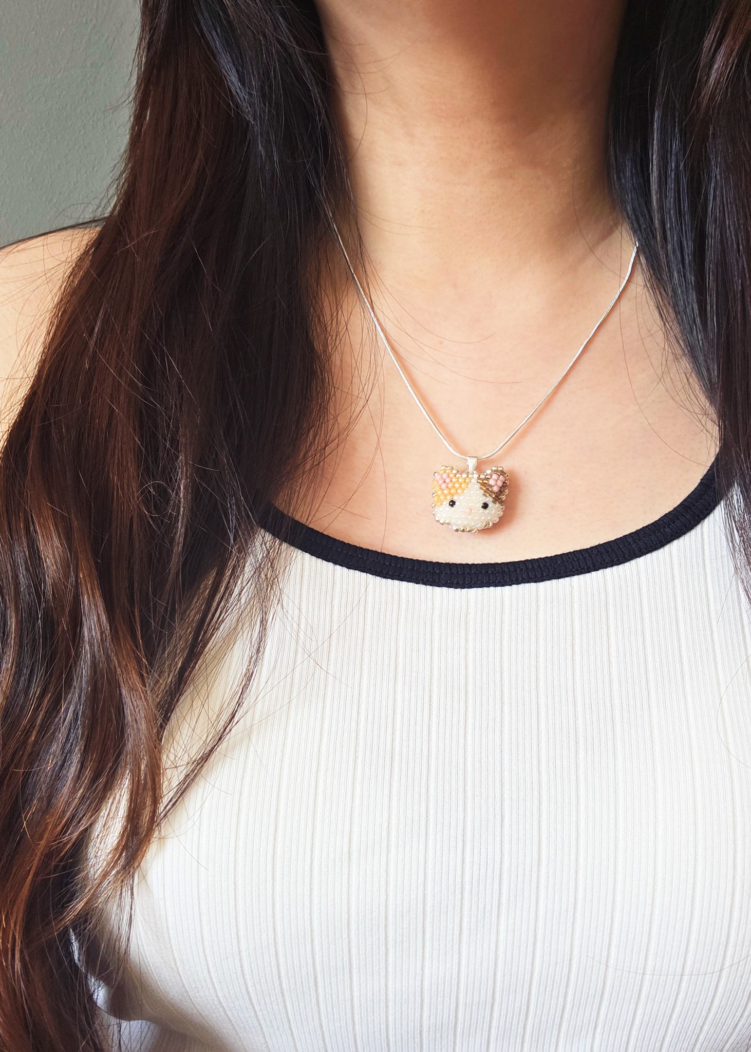 Calico Cat Necklace in Orange and Brown Model
