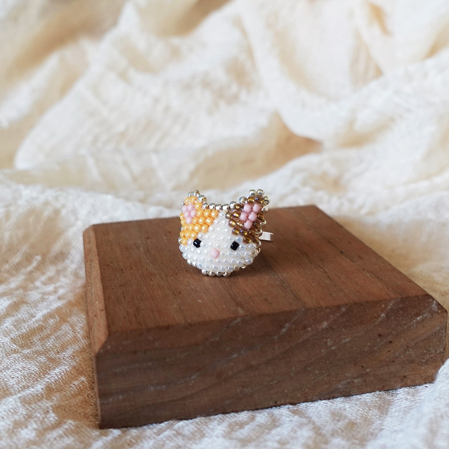 Calico Cat Ring in Orange and Brown Display Right
