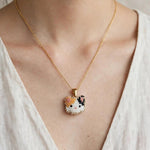Calico cat necklace on model