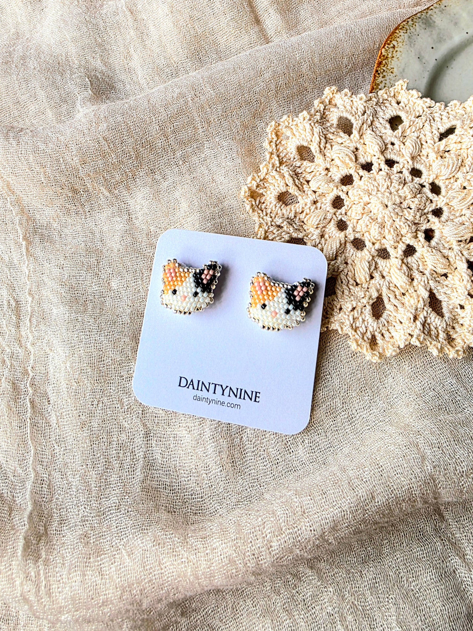 Calico cat stud earrings on card