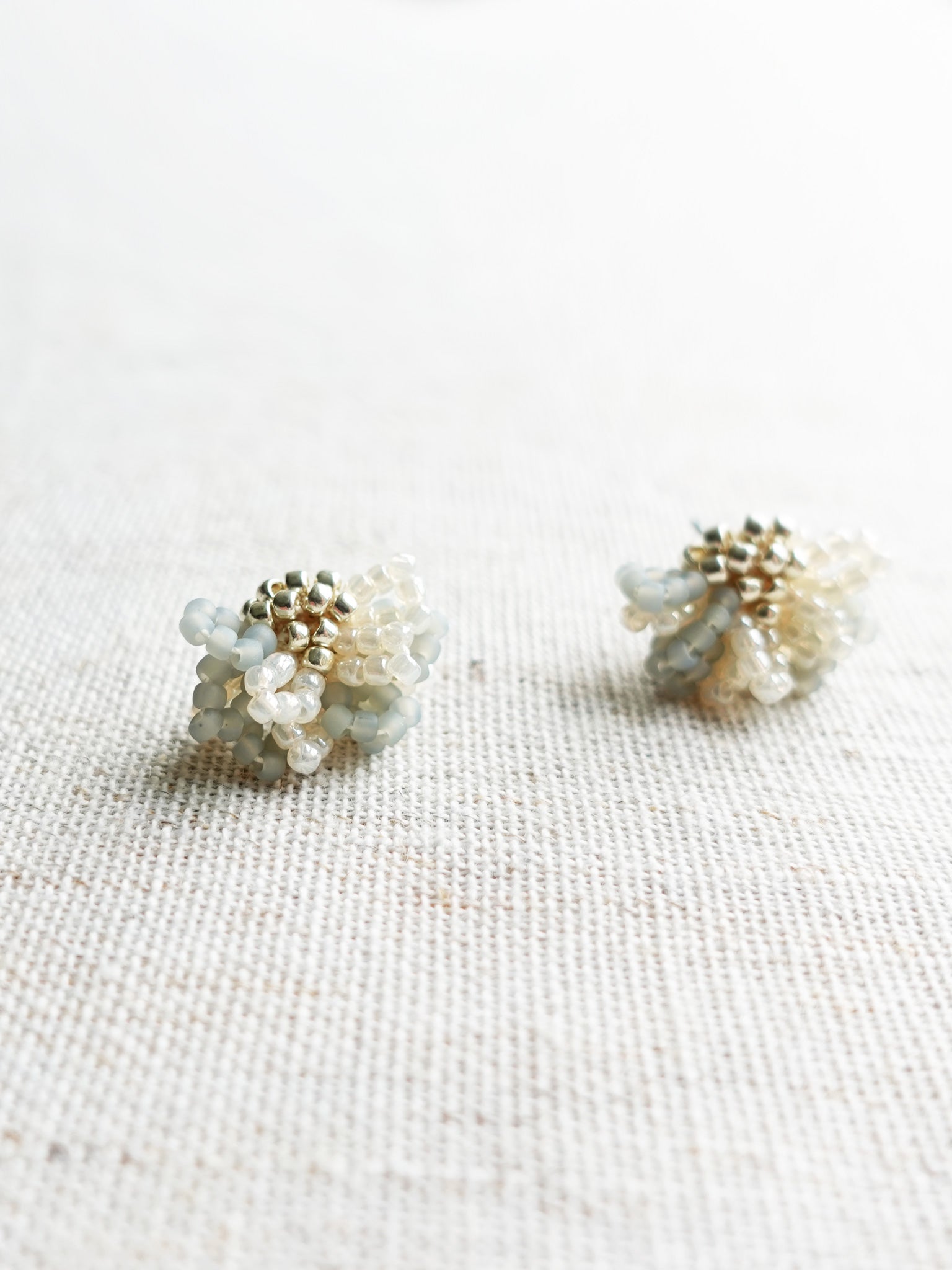 Camellia Bicolor Stud Earrings in Smoke Grey Left