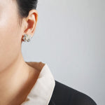 Camellia Bicolor Stud Earrings in Smoke Grey Model