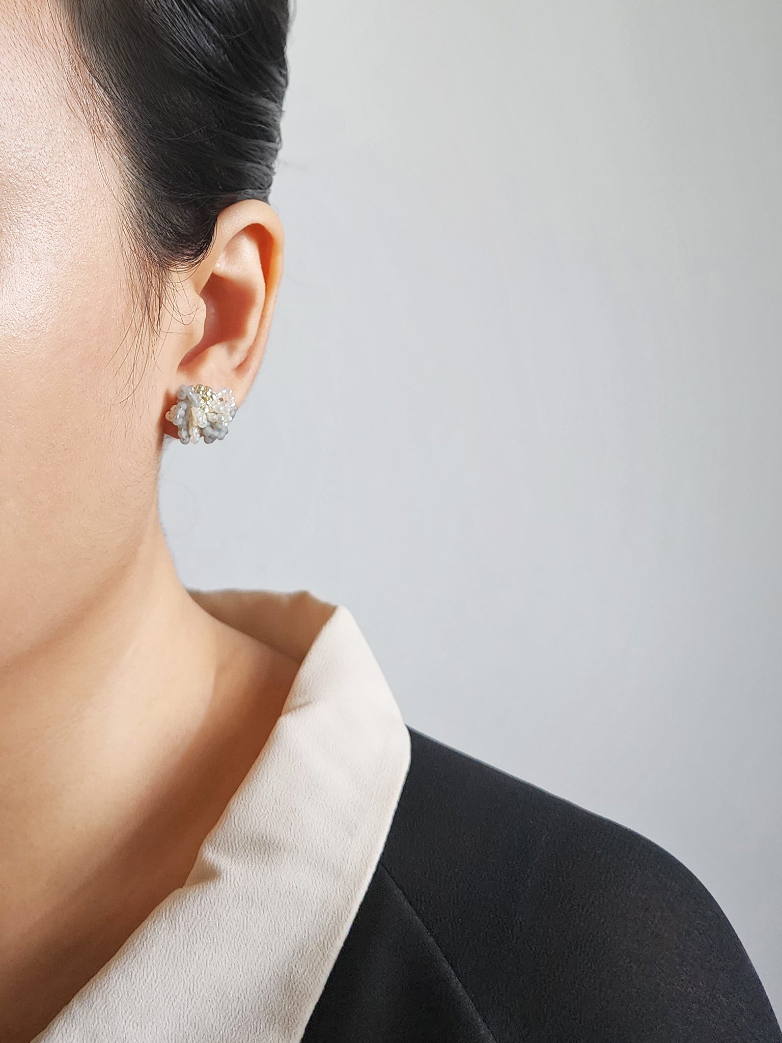 Camellia Bicolor Stud Earrings in Smoke Grey Model