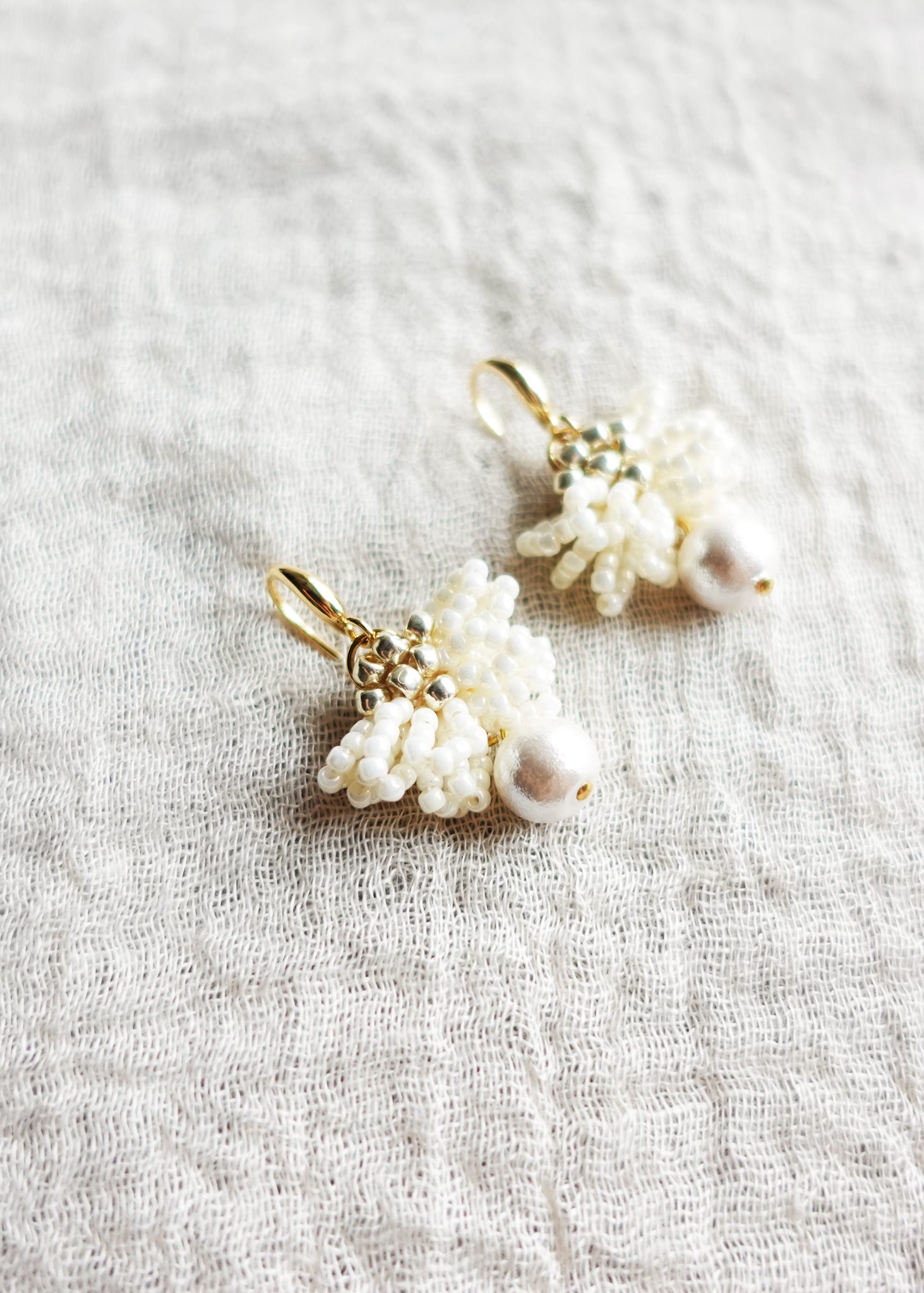Camellia Clo Snowball Dangle Earrings Left Close