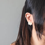 Camellia Clo Stud Earrings in Pearl White Model