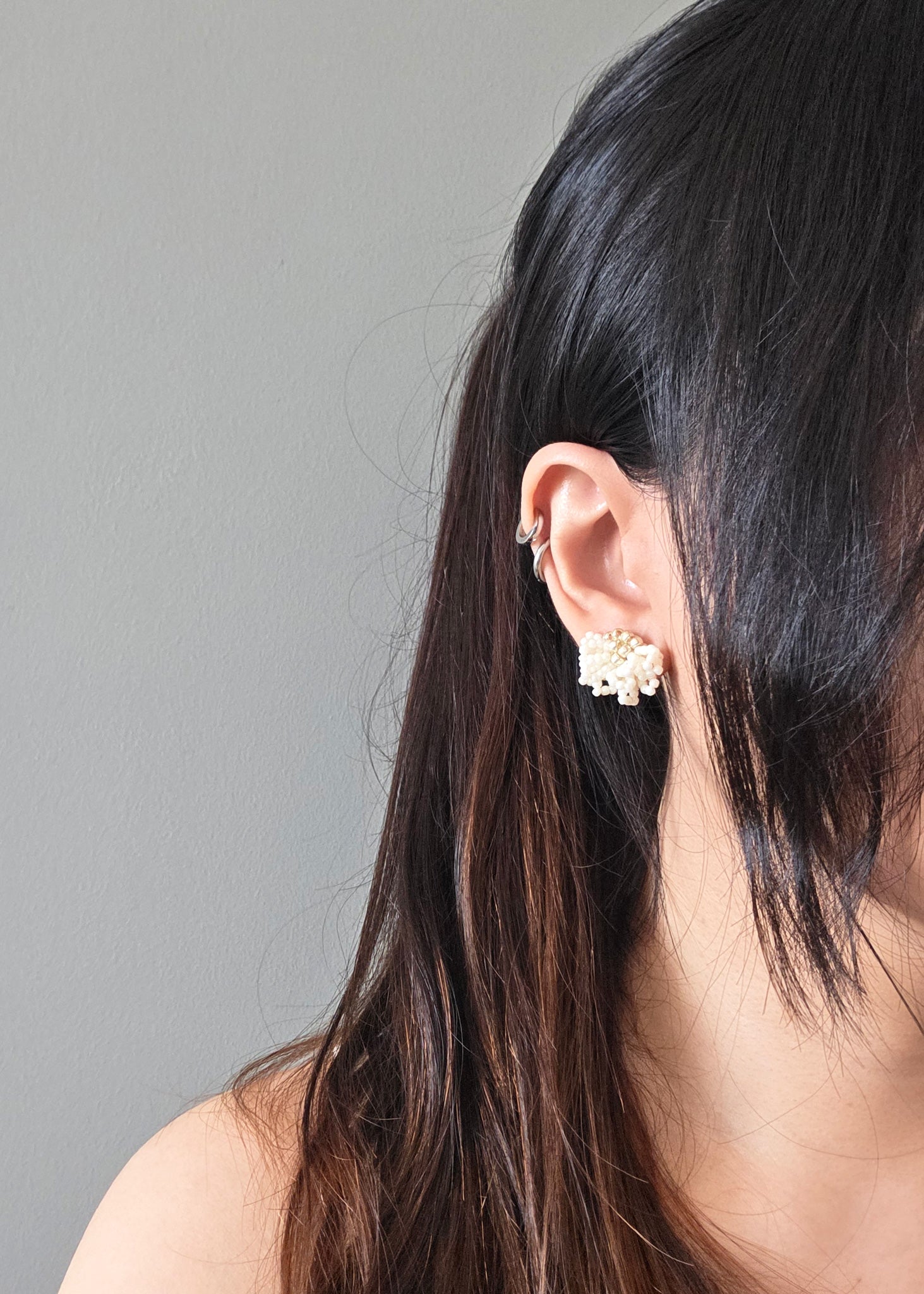 Camellia Clo Stud Earrings in Pearl White Model