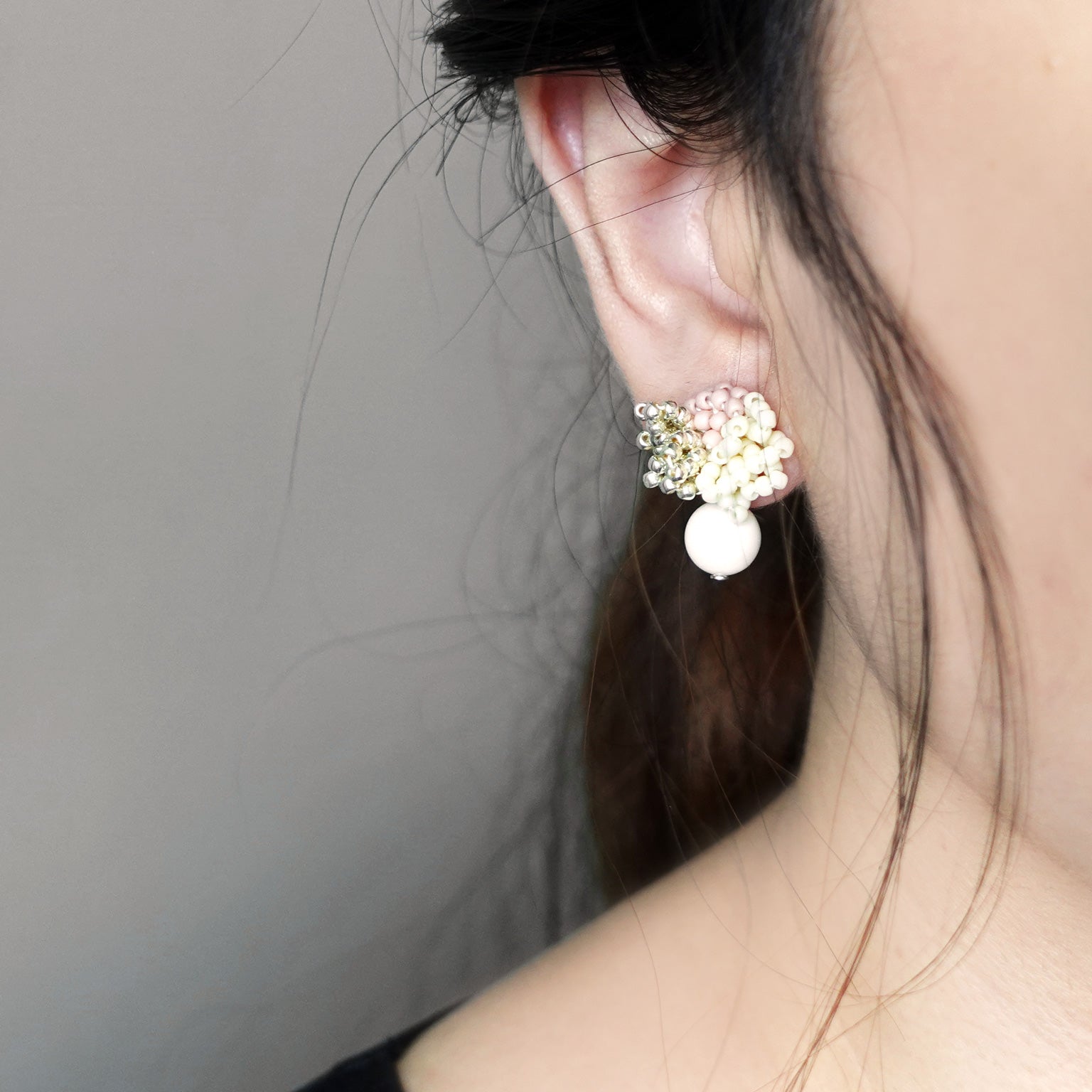 Camellia Cream Drop Earrings in Pale Pink Model