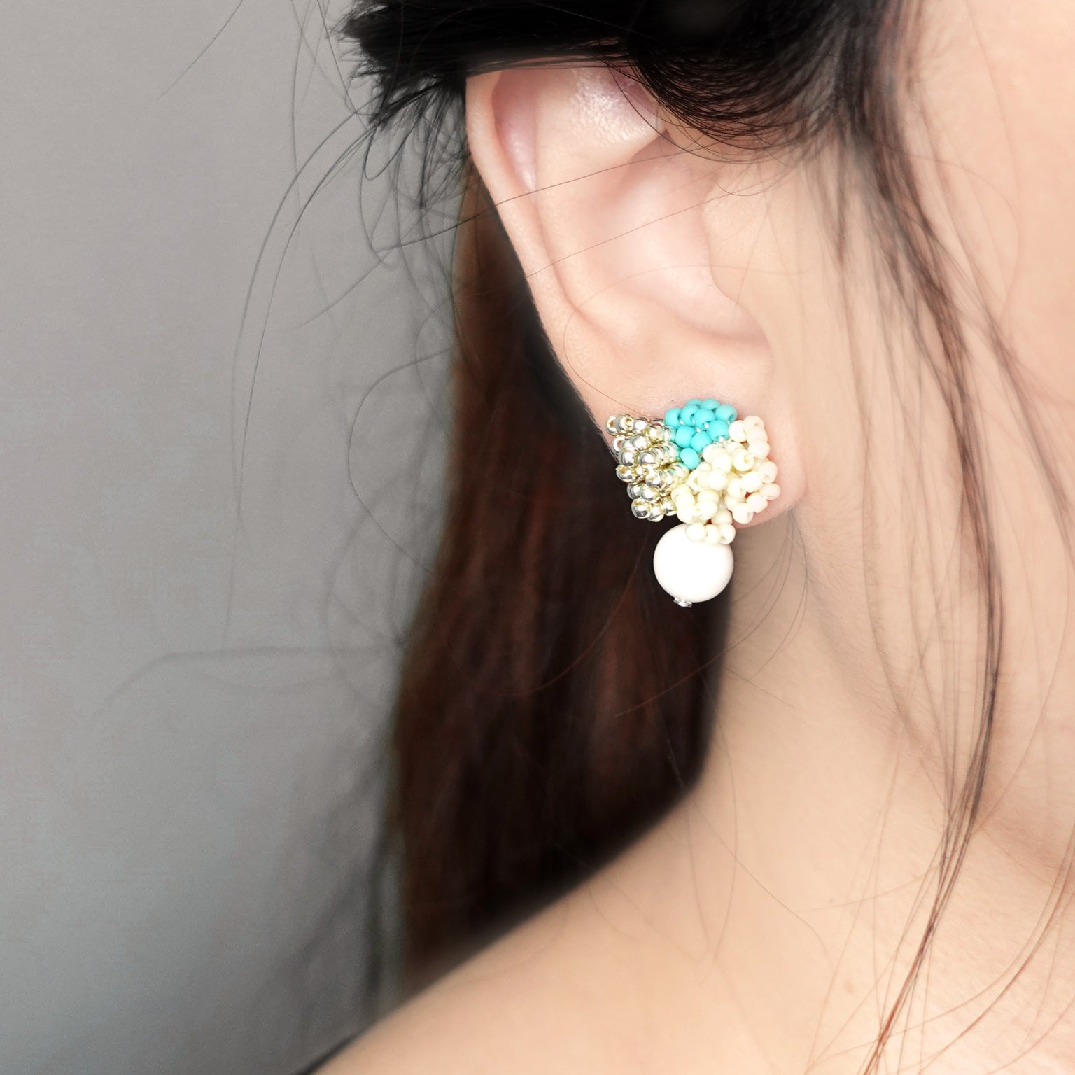 Camellia Cream Drop Earrings in Turquoise Model