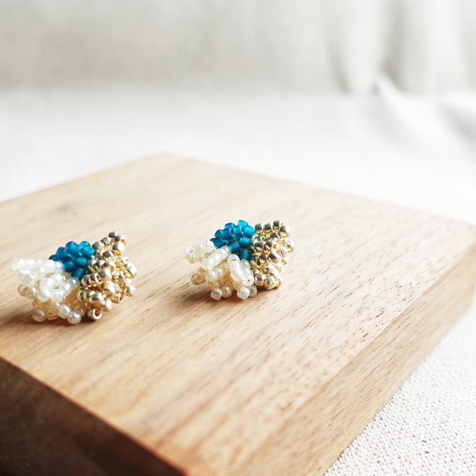 Camellia Dip Stud Earrings in Teal Display