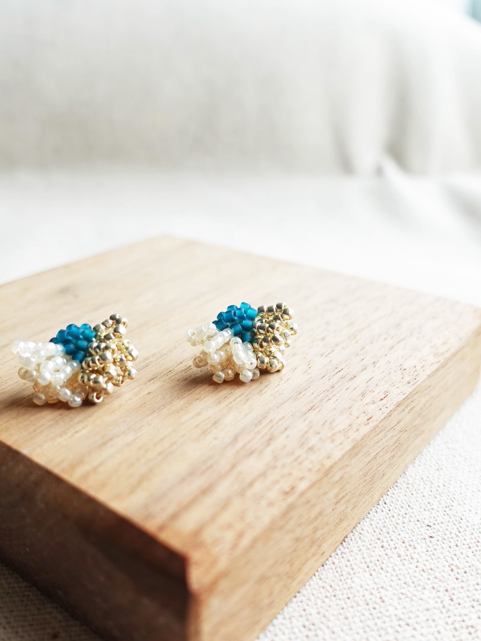 Camellia Dip Stud Earrings in Teal Display