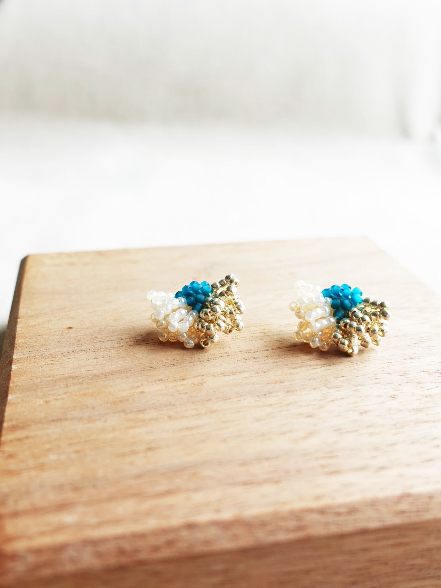 Camellia Dip Stud Earrings in Teal Left