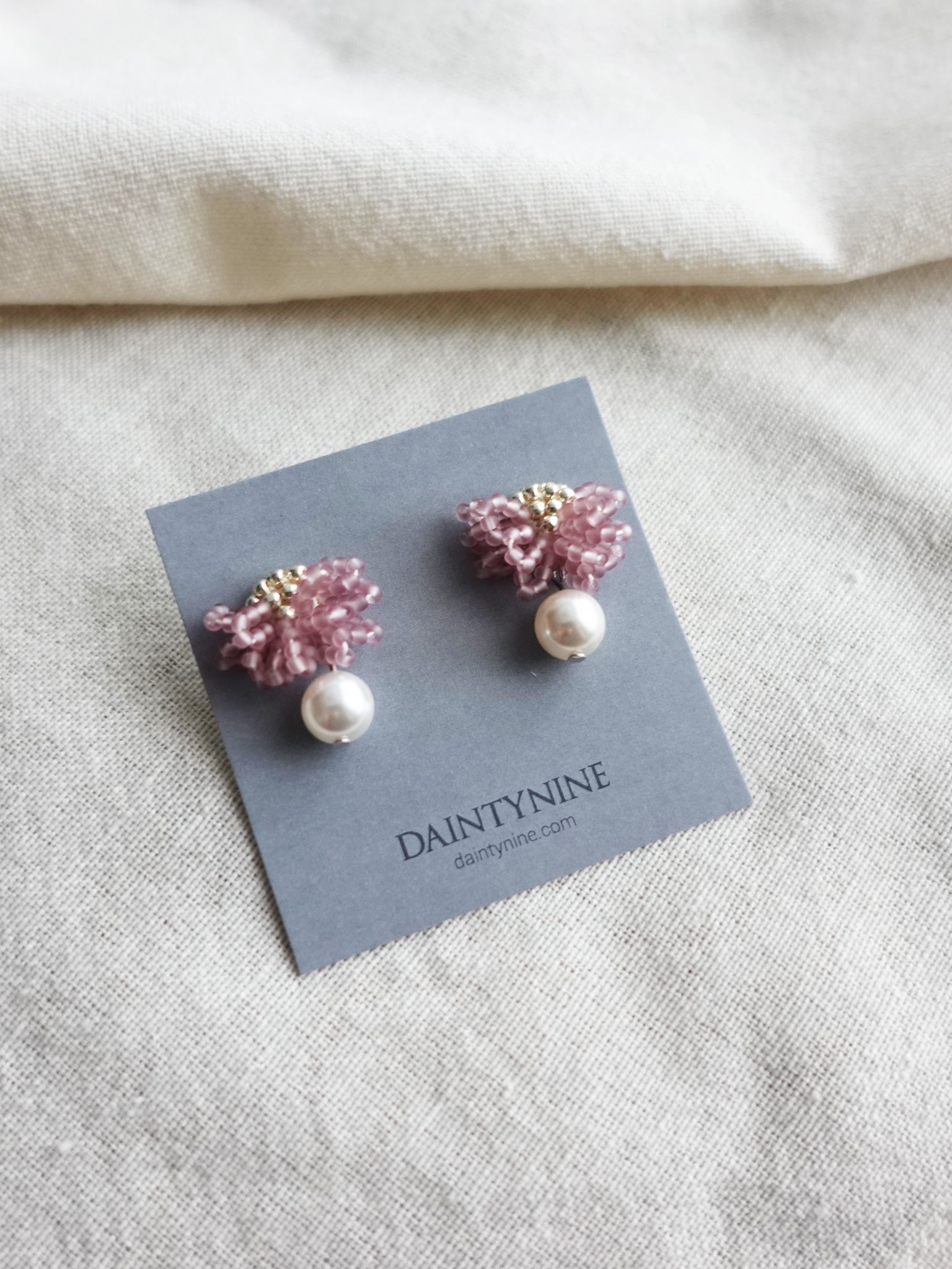 Camellia Mariota Earrings in Mauve Purple Card