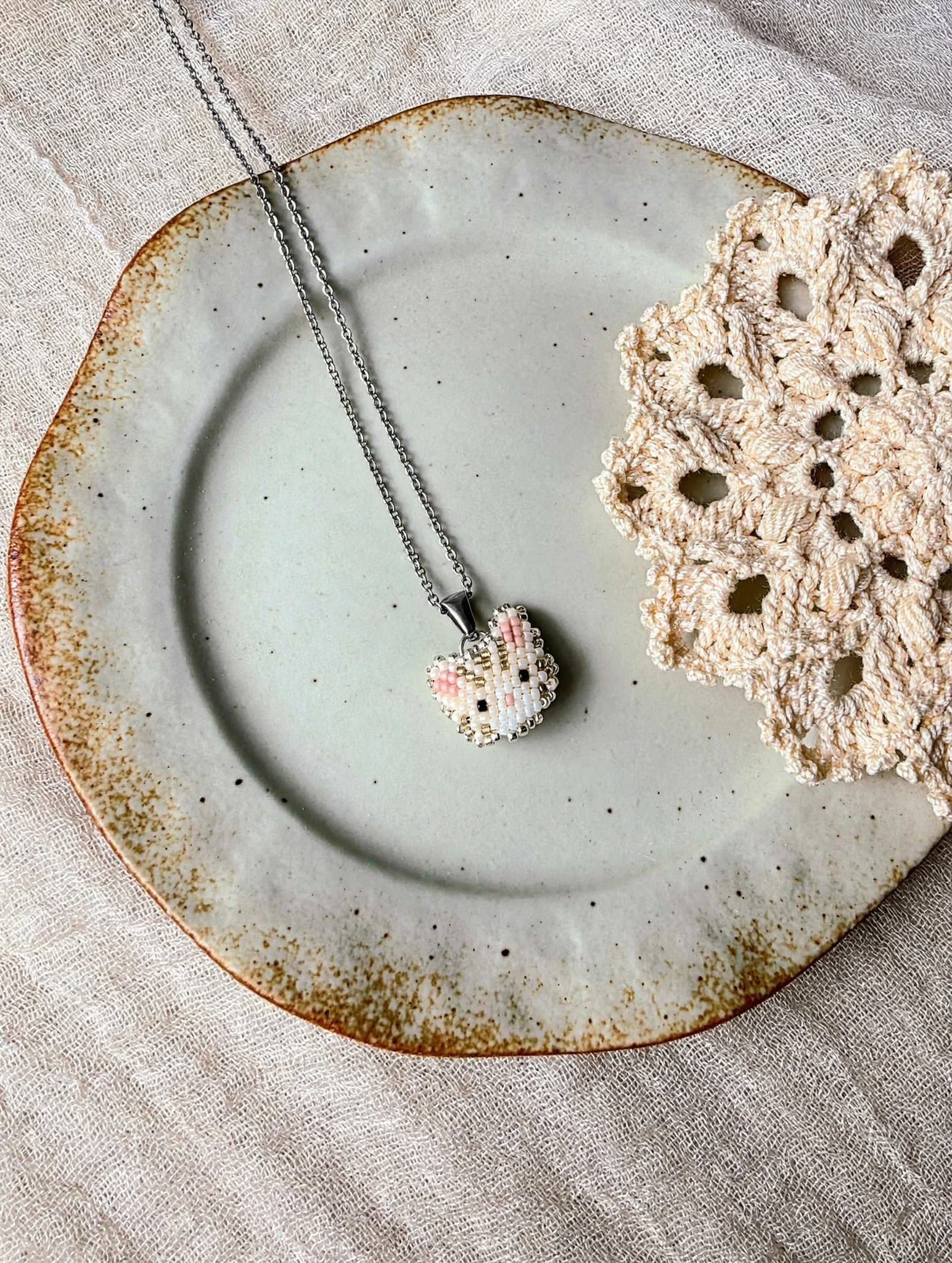 Cream tabby cat necklace in stainless steel