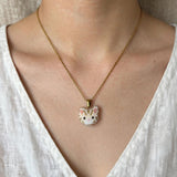Cream tabby cat necklace on model