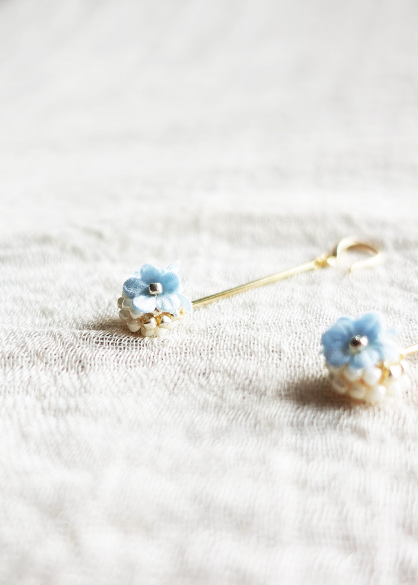 Cyme Petite Dangle Earrings in Blue Close Left