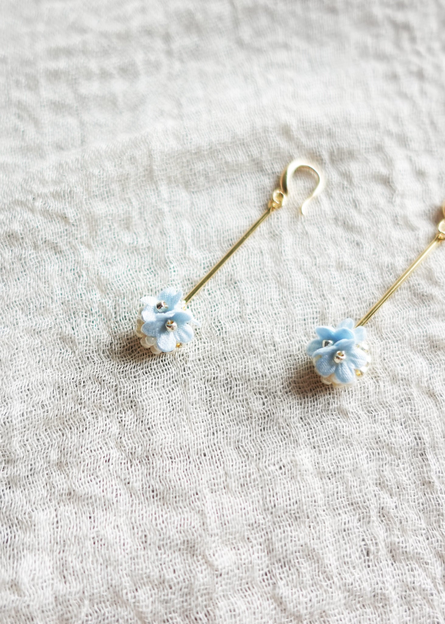 Cyme Petite Dangle Earrings in Blue Front Left