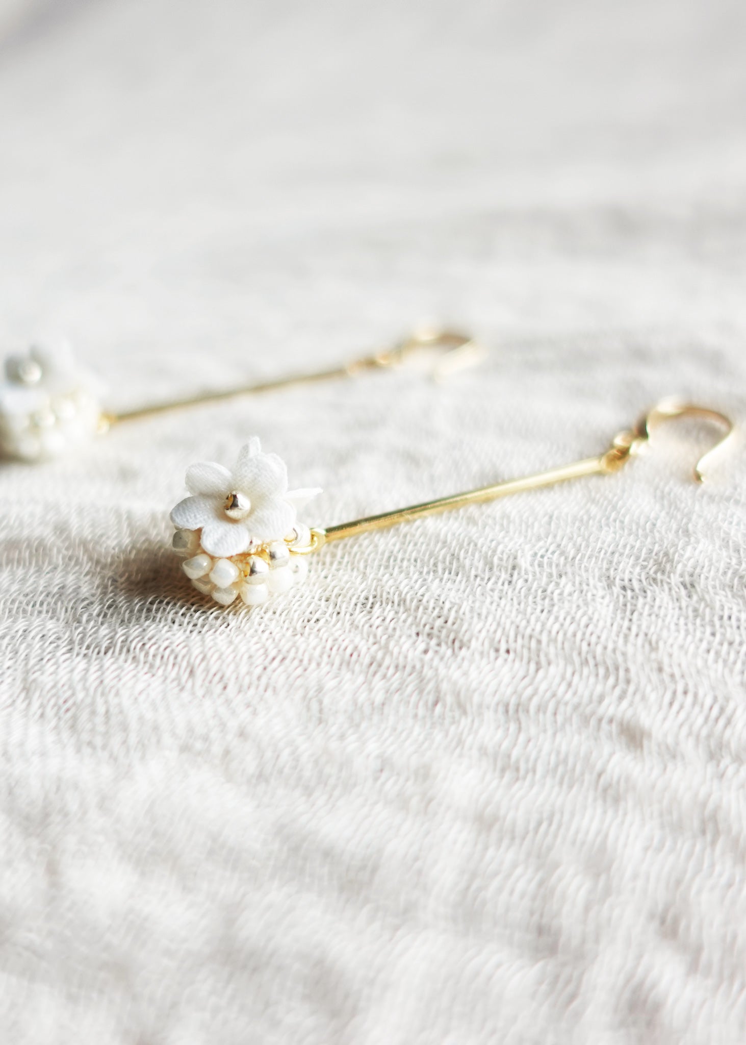 Cyme Petite Dangle Earrings in White Right Close