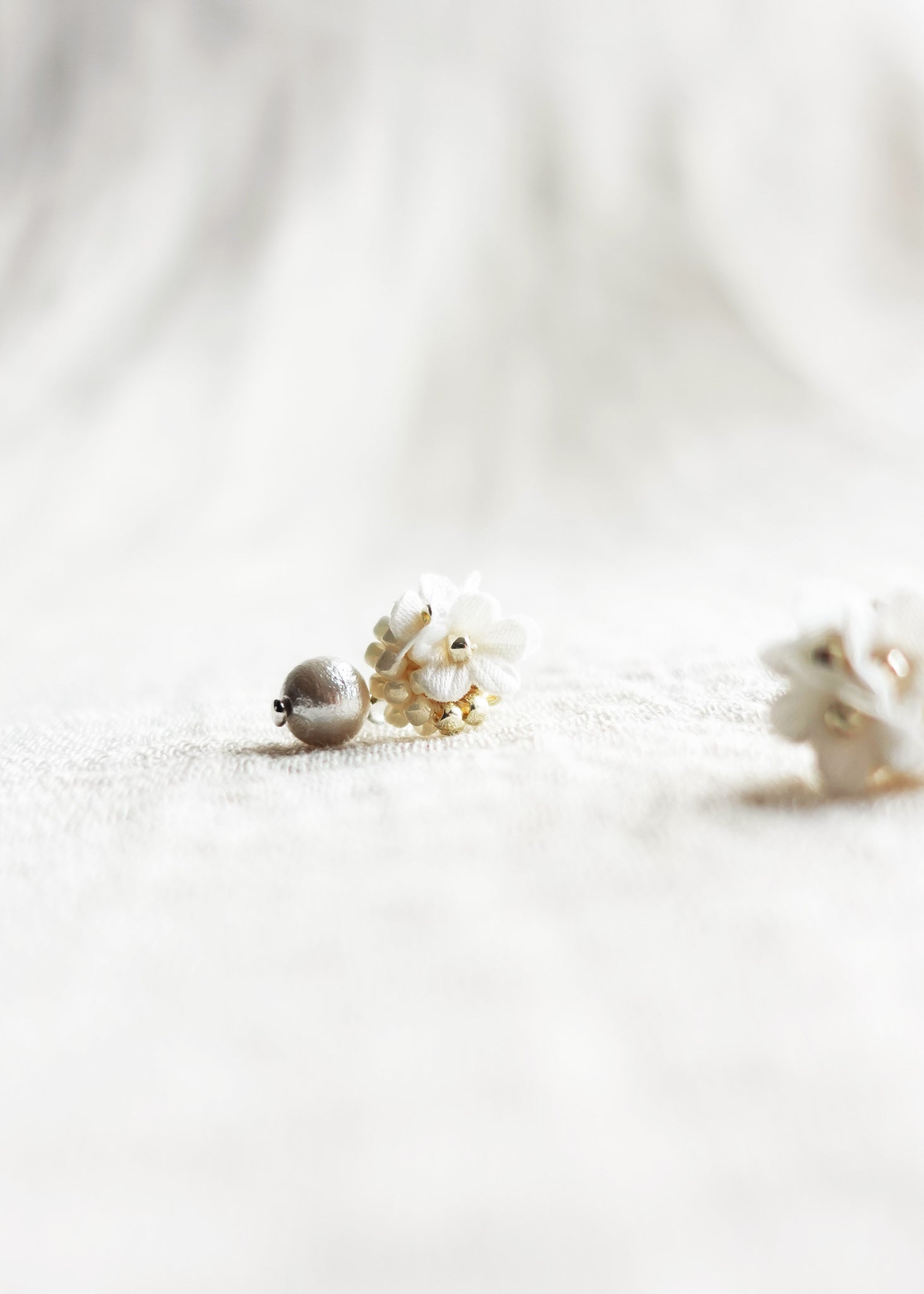 Cyme Petite Snowball Earrings in White Left