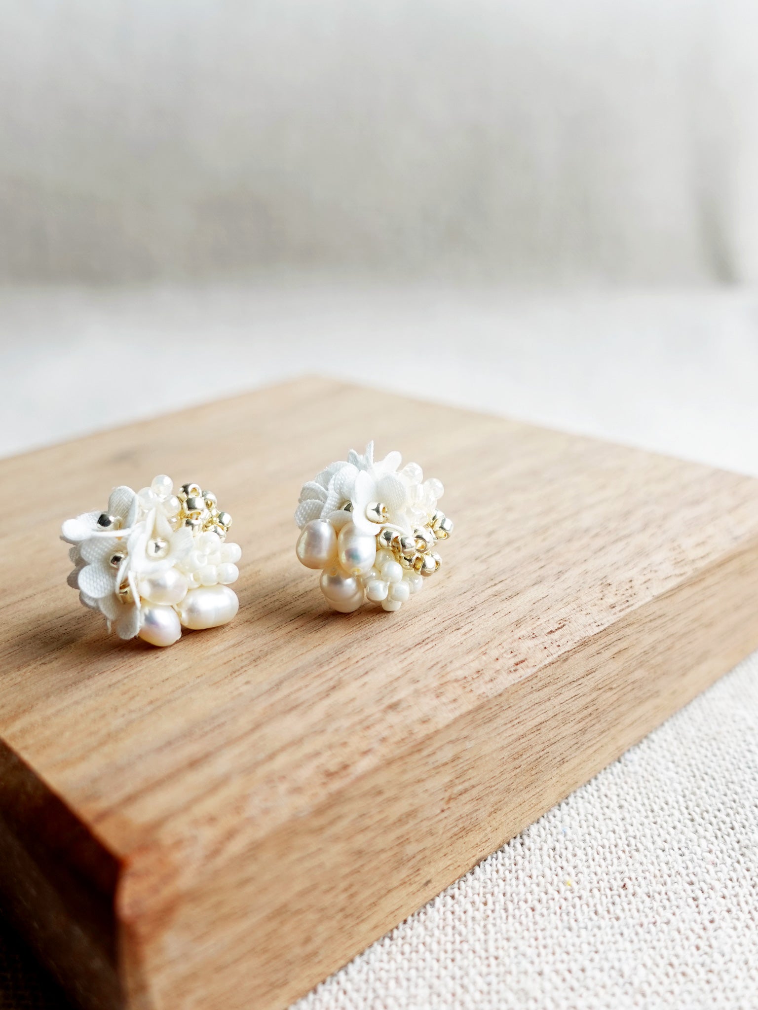 Cyme Stud Earrings in White Display Right