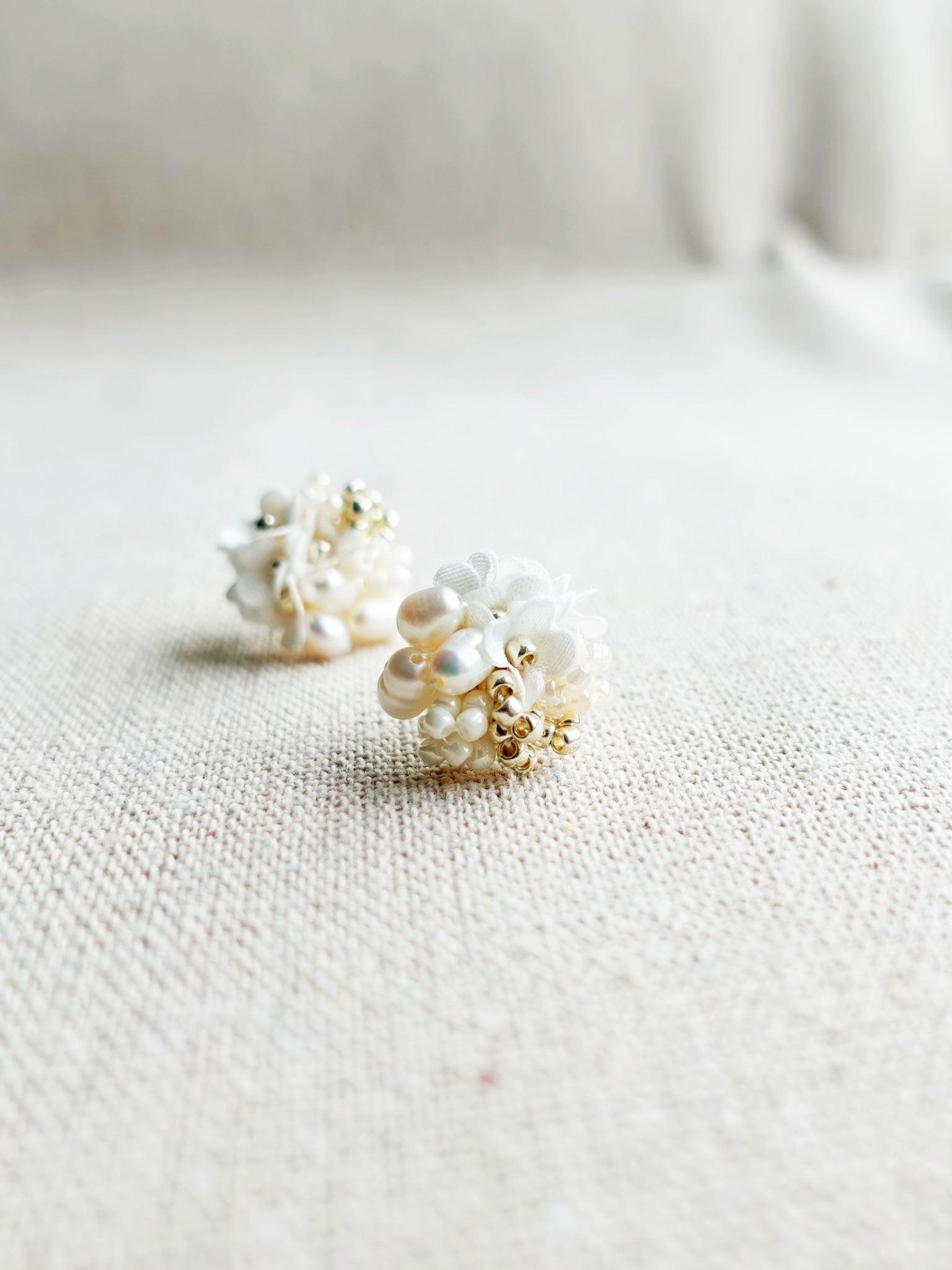 Cyme Stud Earrings in White Front