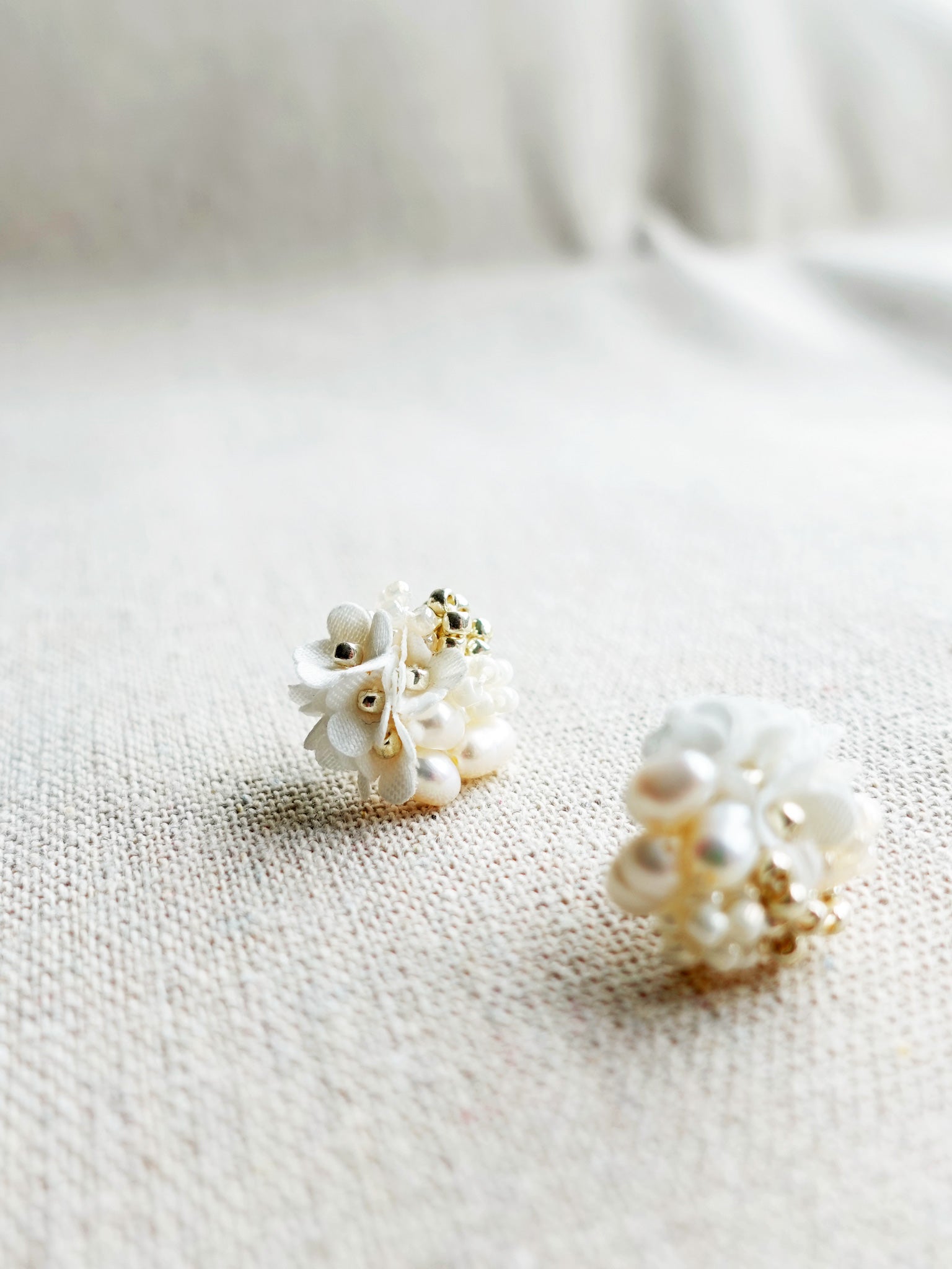 Cyme Stud Earrings in White Left