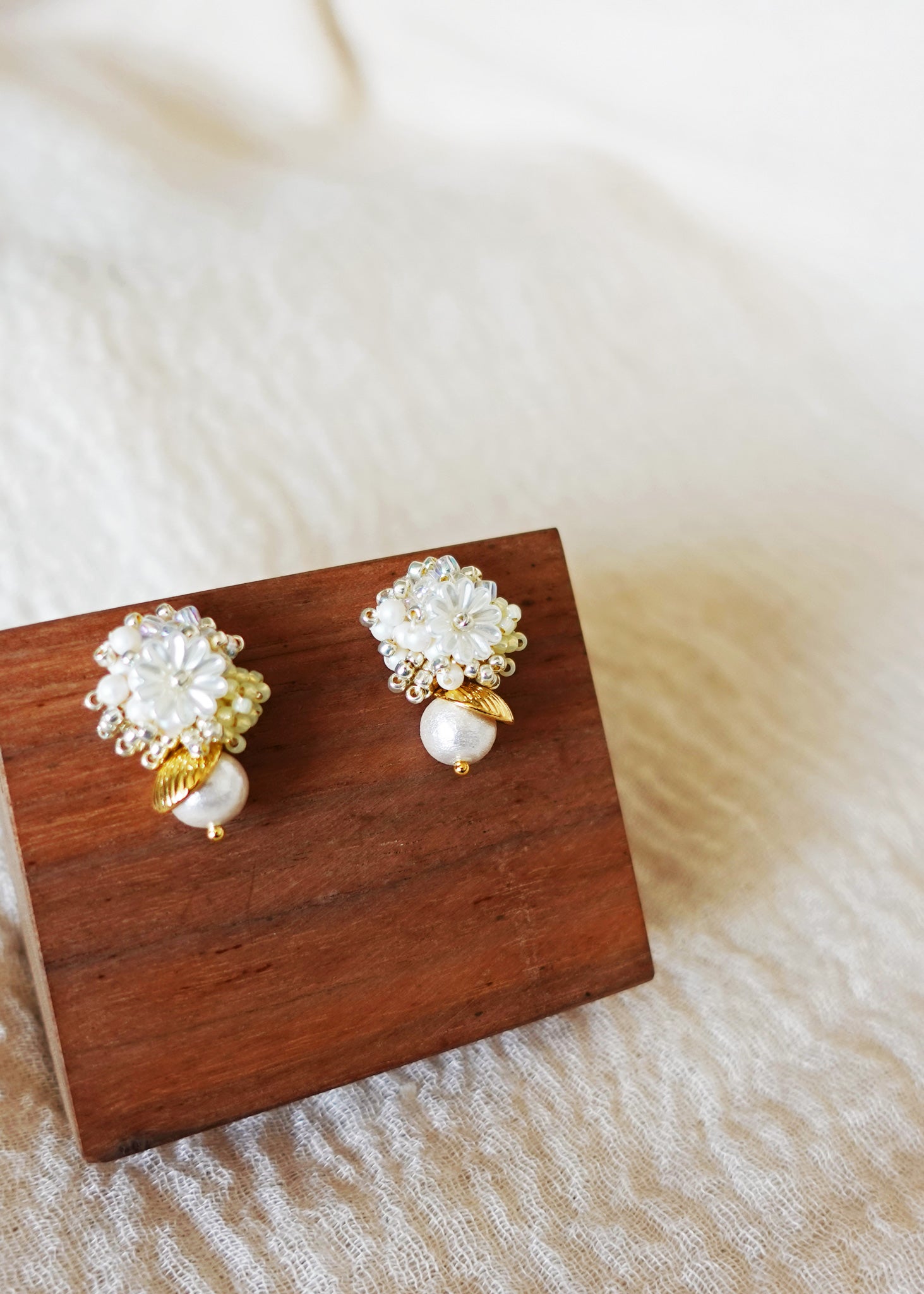 Dianelle Snowball Earrings in Yellow Left
