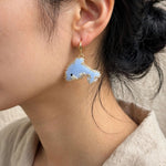 Dolphin Drop Earrings on model