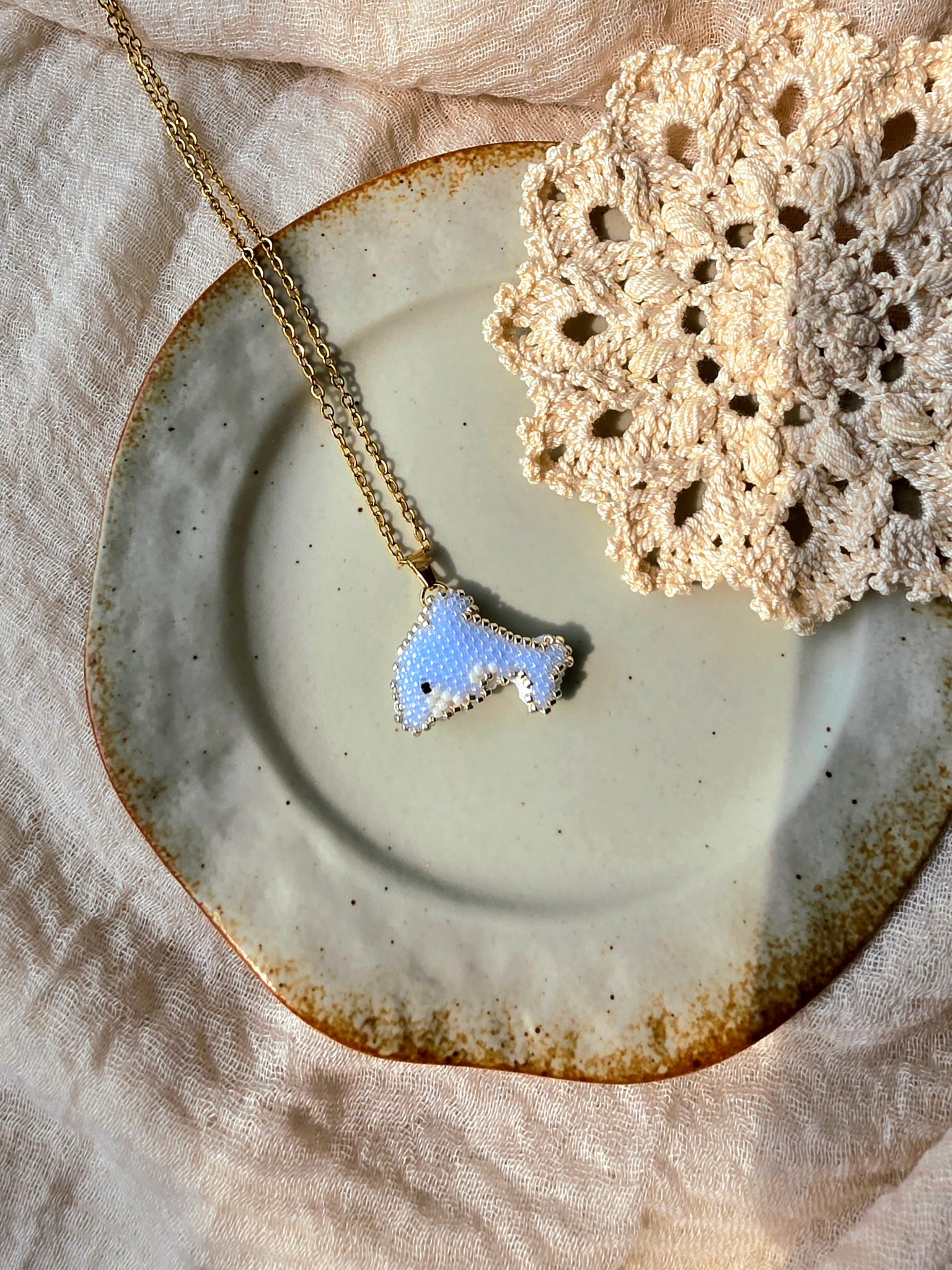 Dolphin necklace left